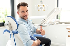 thumbs up from dental patient