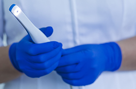 Dentist holding intraoral camera