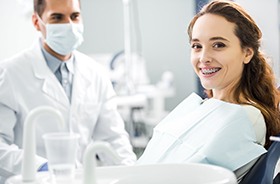 Smiling, young female dental patient wearing braces in New Haven