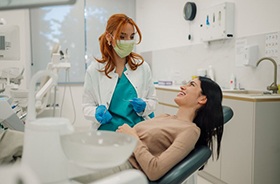 Happy male patient in dental treatment chair