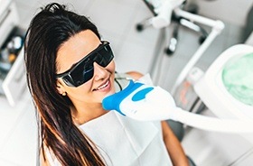 Woman receiving in-office teeth whitening