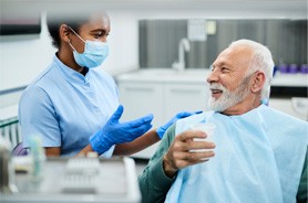 Dentist and patient conversing about treatment plan