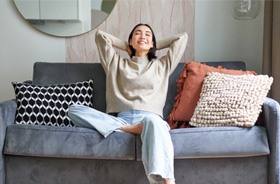 Woman smiling and relaxing at home