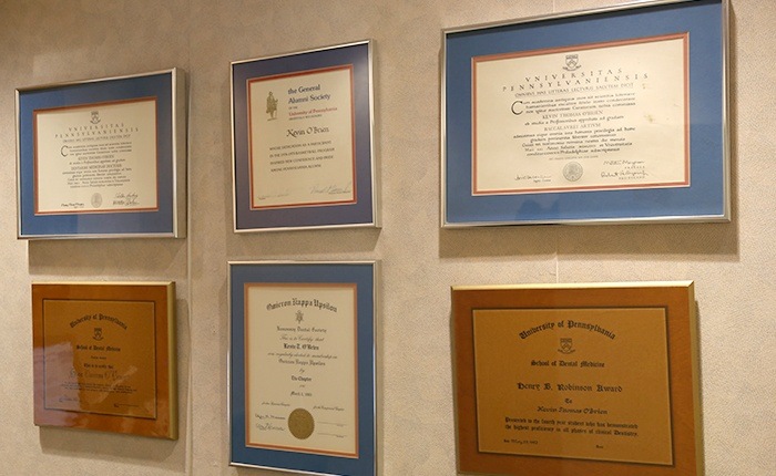 Diplomas and certificates on wall