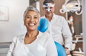 Happy senior patient in dental treatment chair