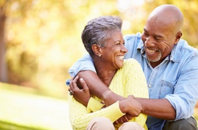 Happy senior couple embracing in outdoor setting