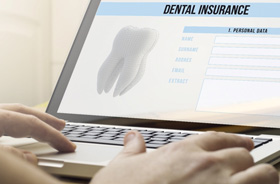 Dental insurance form on laptop computer