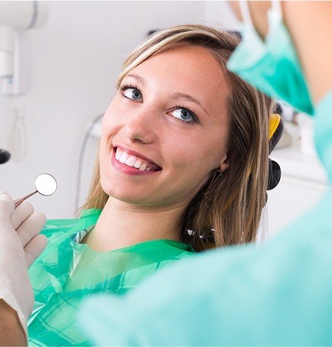 Smiling woman in dental exam room