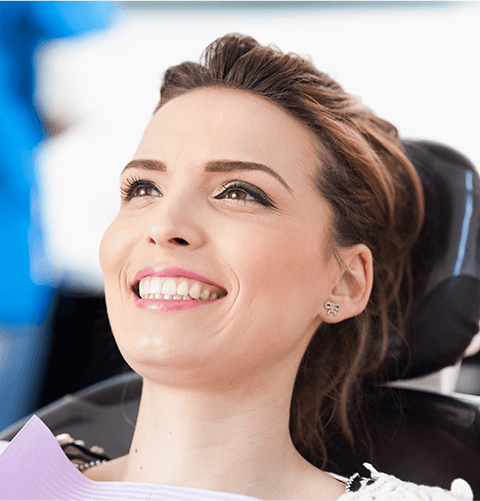 Woman in dental chair smiling