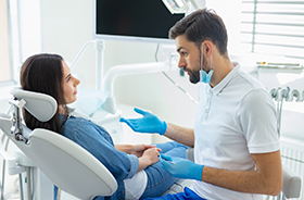 Dentist and female patient discussing sedation dentistry options