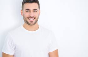 handsome, smiling man with tooth colored fillings in New Haven