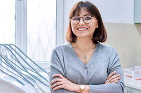 smiling woman in dental treatment room