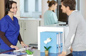 smiling woman in dental treatment room