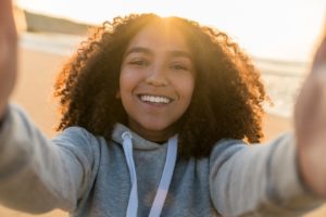 Teen girl with beautiful smile thanks to cosmetic dentistry