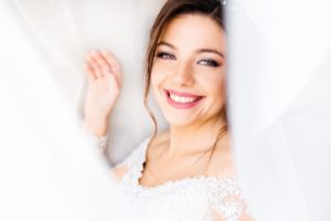 Bride with bright smile after teeth whitening in New Haven