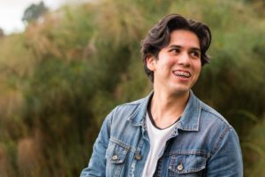 Smiling young man, happy he could afford the cost of orthodontic treatment in New Haven