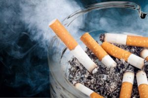 Close-up of several cigarettes in ashtray