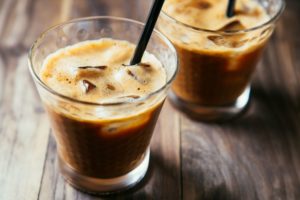 Close-up of iced coffee with straw