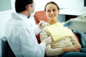 Dentist and patient talking about treatment options