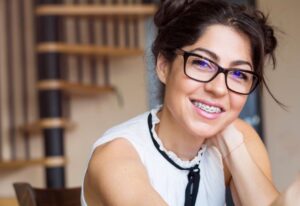 Smiling professional woman with braces 